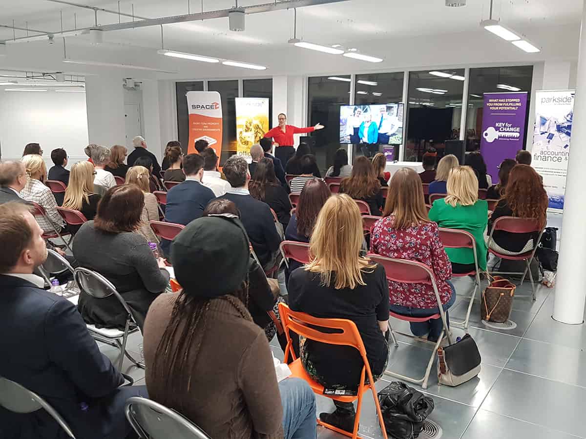 Keeley Taverner leading a live Key for Change workshop, presenting to a full room of attendees