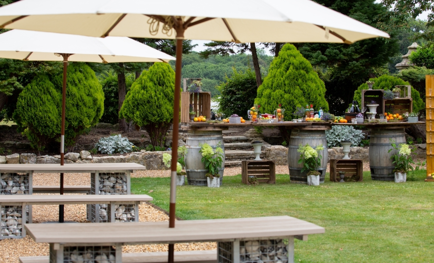 The estate gardens set up for open-air refreshments among the grounds